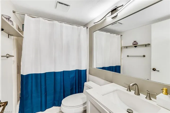 Full bathroom featuring vanity and shower / bath combo