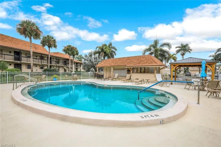 Community pool with a patio and a gazebo