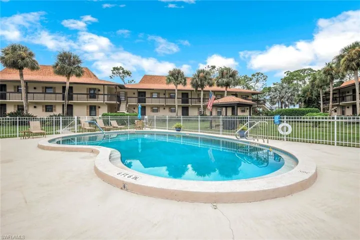 Community pool with a patio area