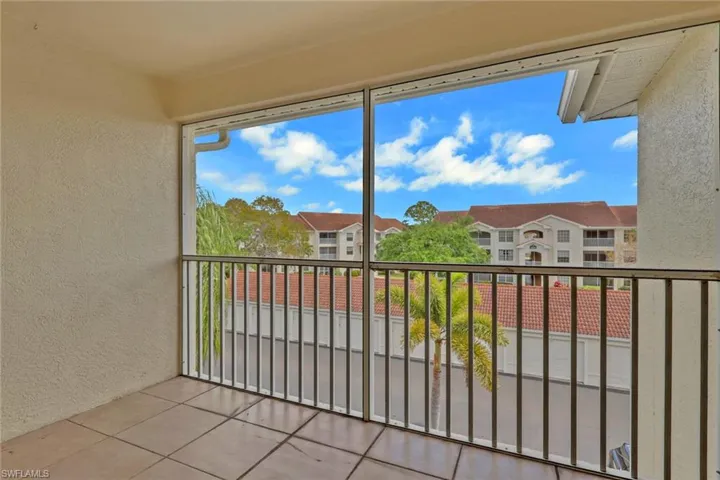 Balcony featuring a sunroom