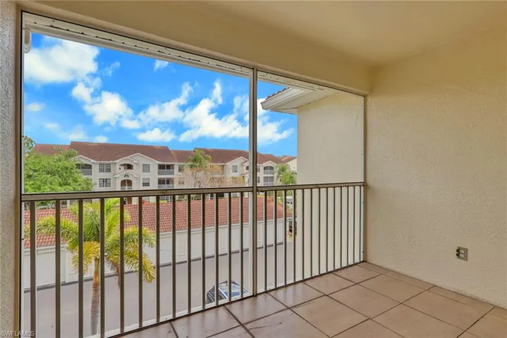 Balcony featuring a sunroom