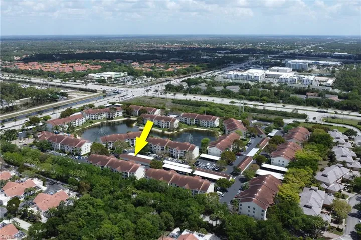 Aerial view of property's location featuring a large body of water