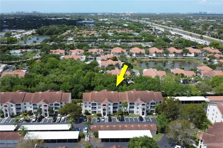 Aerial overview of property's location with a nearby body of water