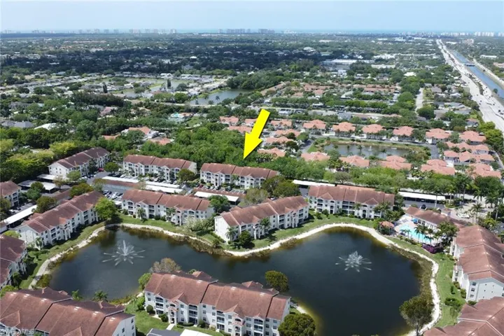 Aerial view of property's location featuring a large body of water