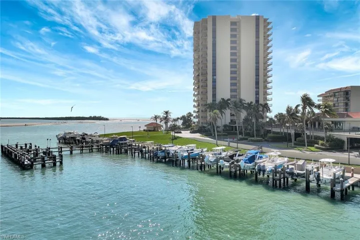 Property view of water with a dock