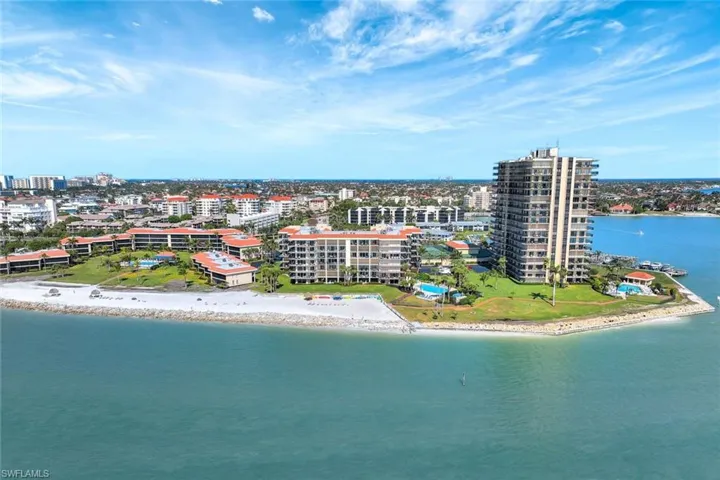 Drone / aerial view with a beach view and a water view