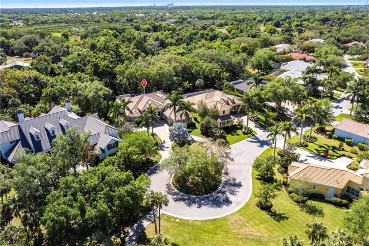 Birds eye view of property with a residential view and a forest view