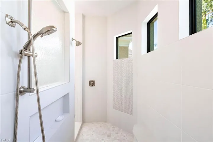 Full bathroom with a tile shower