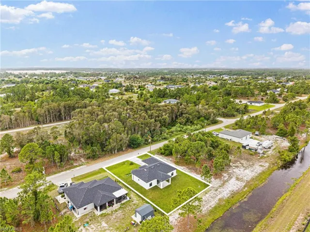 Aerial view of residential area with a large body of water