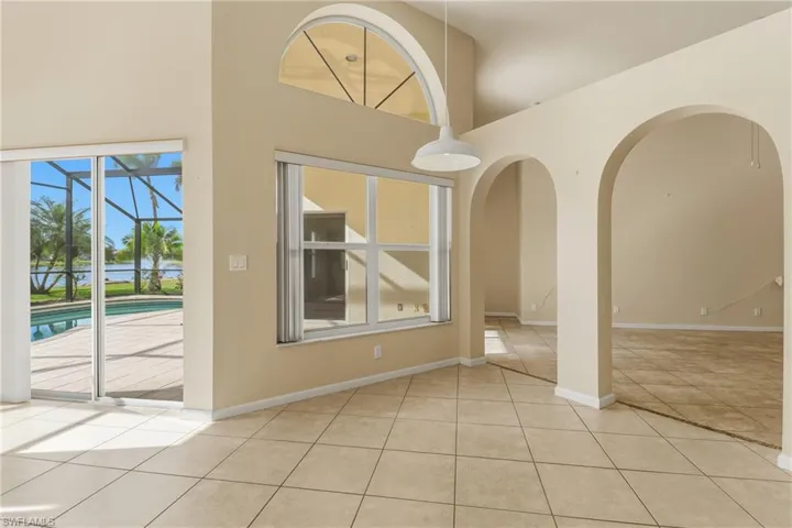 with view of pool area and lake