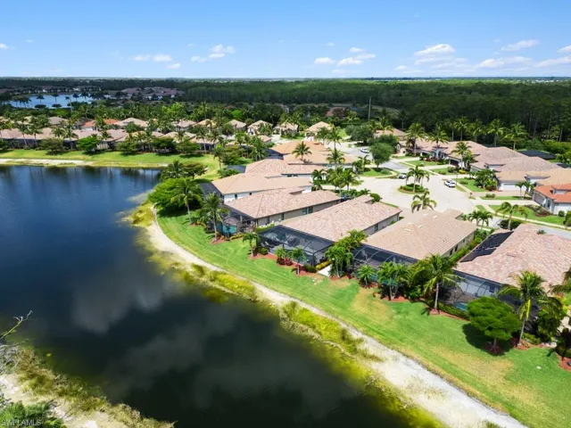 Drone / aerial view with a water view and a residential view