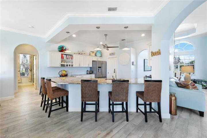 KITCHEN LOOKING IN AND GUEST SUITE HALL