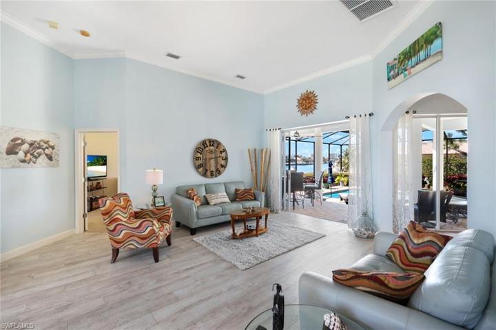 LIVING ROOM TO PRIMARY BEDROOM AND LANAI