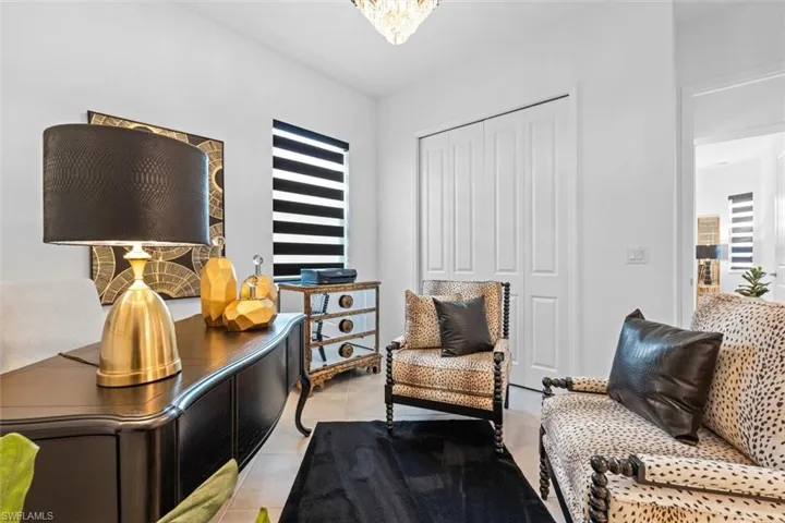 Sitting room with light tile flooring