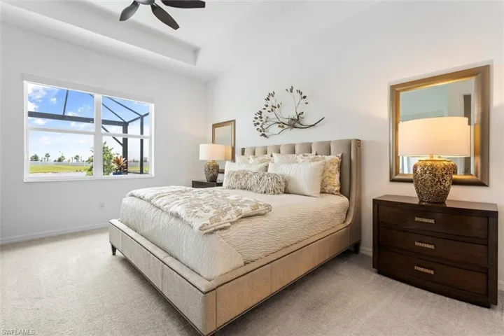 Carpeted bedroom with ceiling fan