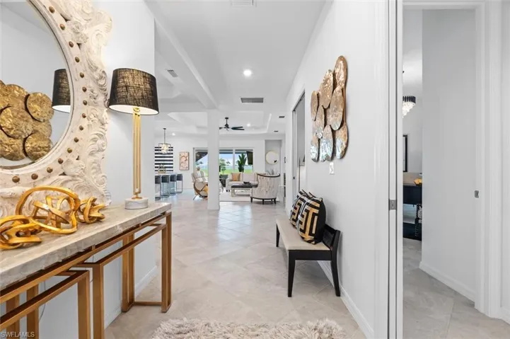 Hall featuring light tile floors