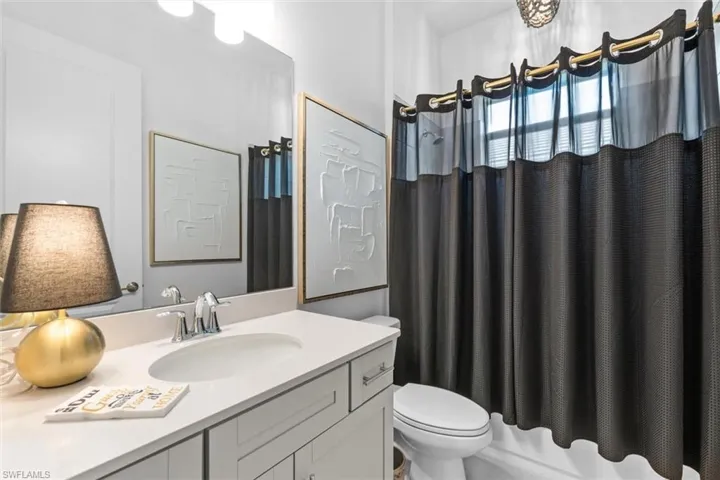 Bathroom with vanity and toilet