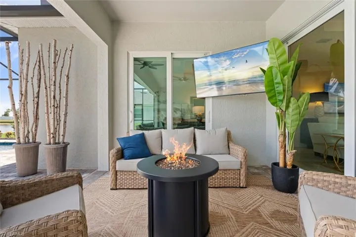 View of patio / terrace with an outdoor living space with a fire pit