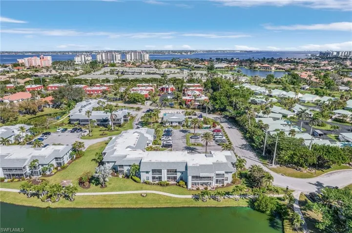 View of property location featuring a large body of water and nearby urban area