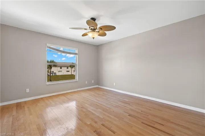 2nd floor bedroom 2 featuring light hardwood / wood-style flooring and ceiling fan