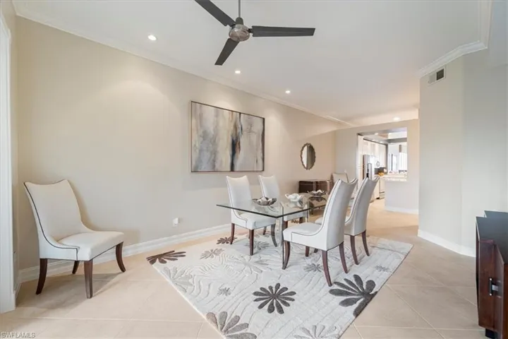 Dining area featuring recessed lighting, visible vents, ornamental molding, light tile patterned flooring, and baseboards