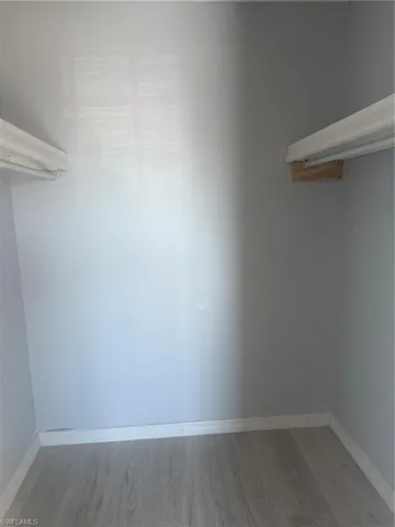 Walk in closet featuring light wood finished floors