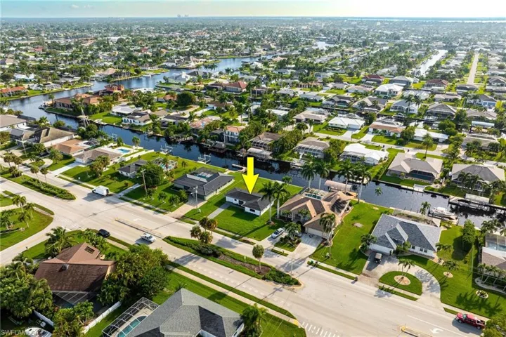 Aerial view featuring a residential view and a water view