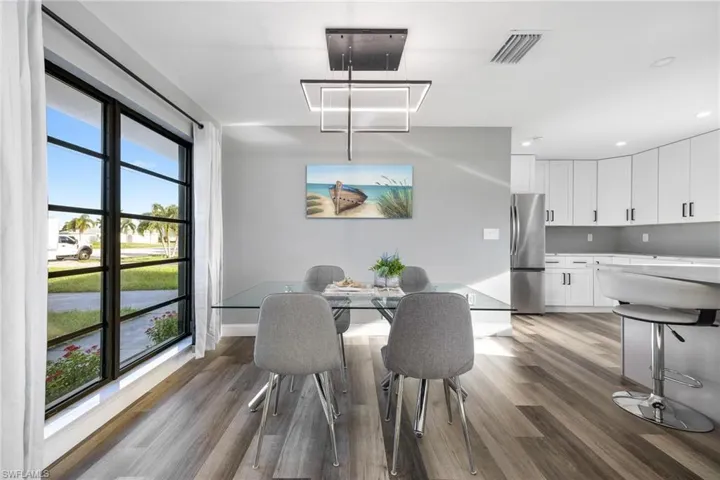 Dining room featuring recessed lighting, visible vents, baseboards, and wood finished floors