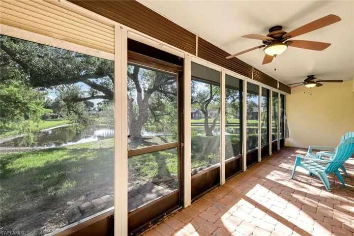 Screened lanai with fans overlooking the beautiful Live Oak and lake!  Access the lanai by the master bedroom or Living area!