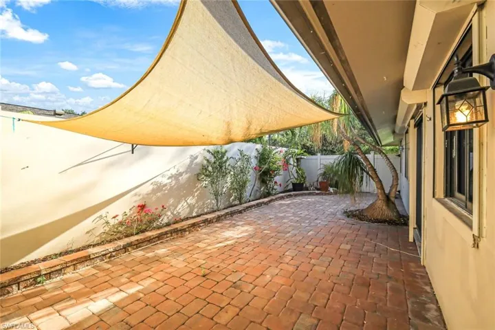 This privately walled patio has west, northern and eastern exposure, so it is perfect for a winter and summer garden, offering pavers with plenty of space for a full furniture set with table and chairs, loungers and PLENTY of room to add an outdoor kitchen!