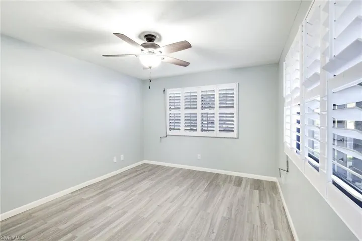Guest bedroom with plantation shutters and large extra windows allowing extra light!