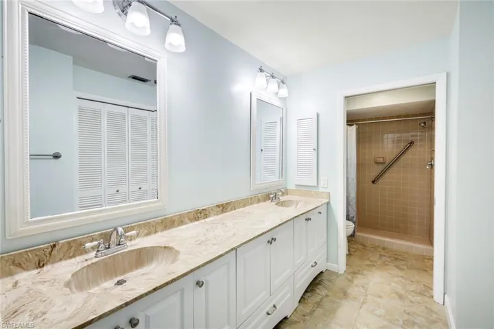 Massive master bath vanity offering extra storage, 2 sinks with upgraded mirrors, cabinet and lighting!