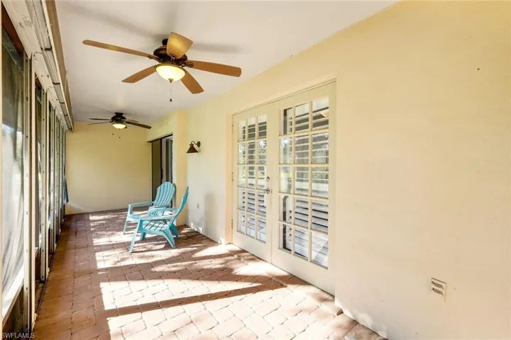 Screened lanai with French doors to the living area which is overlooking the beautiful Live Oak and lake!  Access the lanai by the master bedroom or living area!