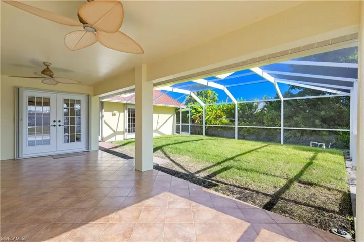 Unfurnished sunroom with french doors