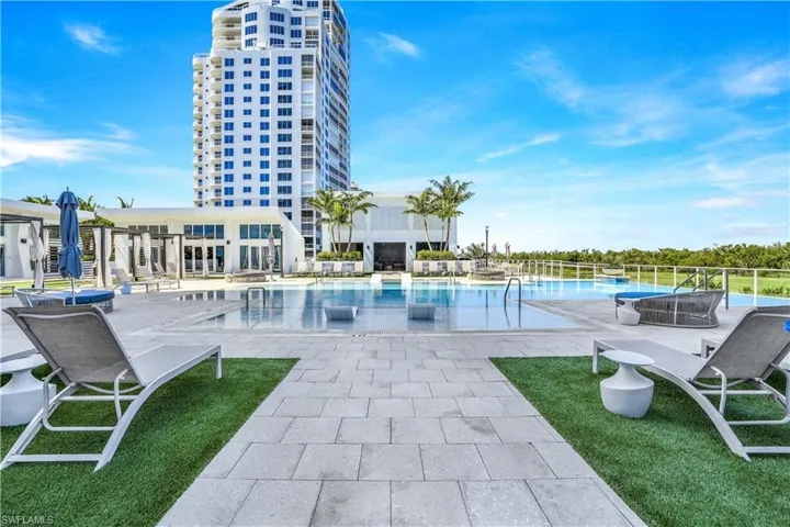 Pool with beach entry, sun shelves, infinity edge pool.