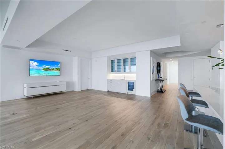 Wet bar with sub-zero wine cooler is perfectly located in the great room.