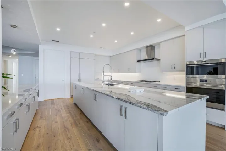 Gas cook-top, wall oven, walk-in pantry, and a massive island provide the ultimate in culinary perfection.