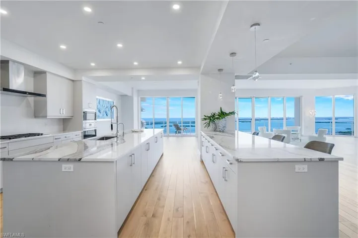 Gorgeous cabinetry, large island, & luxurious quartz countertops. This kitchen is a chef's dream.