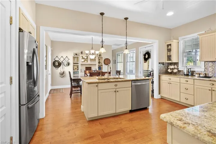Kitchen has great natural lighting open to the dinning area. Also features a breakfast bar.