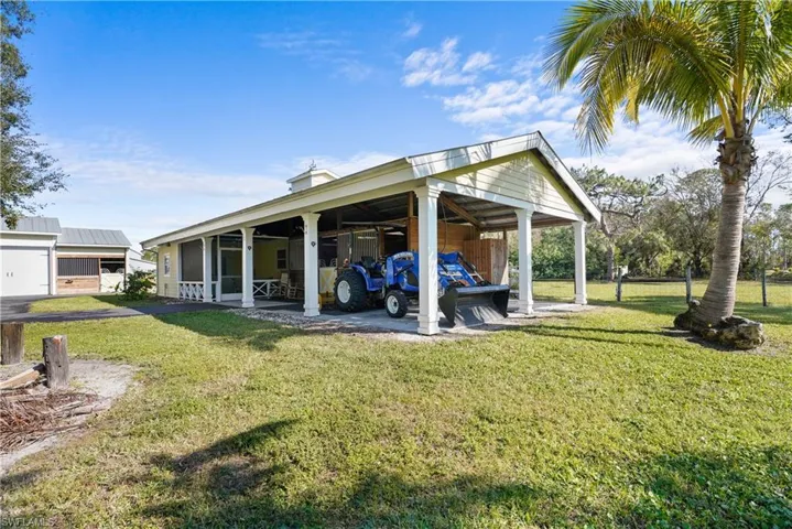 Barn with 2 horse stalls covered washing area with enclosed shower and sink. Also has a 1 bedroom, 1 bath apartment, with kitchenette, new ductless air conditioner and screen porch.