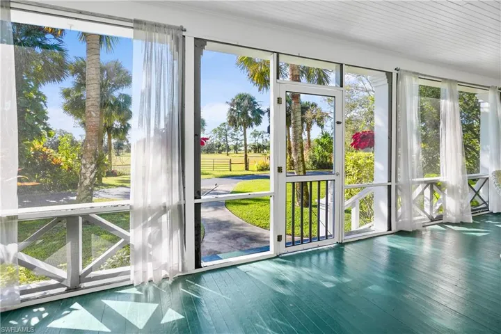Welcoming screen porch entry.
