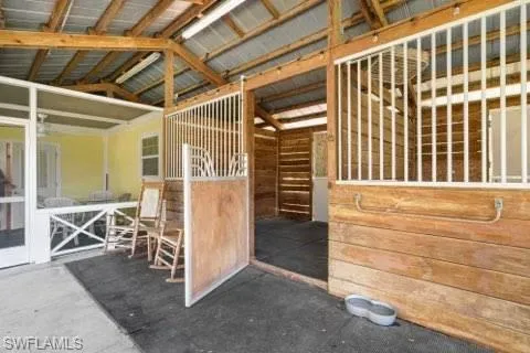 View of stable stalls are horse ready with floor mats.