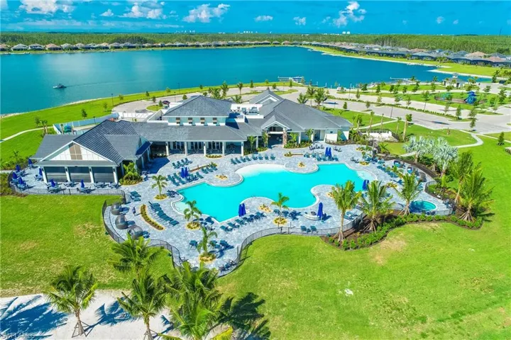 Drone / aerial view of a pool and a large body of water