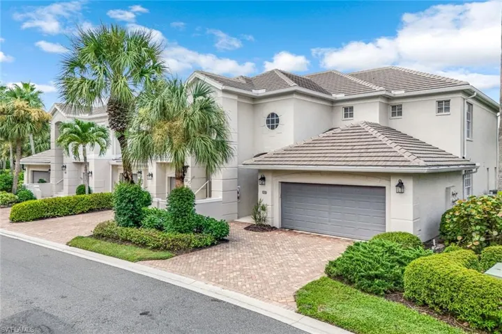 Lovely landscaped front entryway.