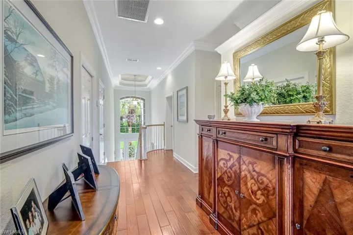 Wide entry foyer leading to great room and bedrooms. Elevator access is at the top of the stairway.