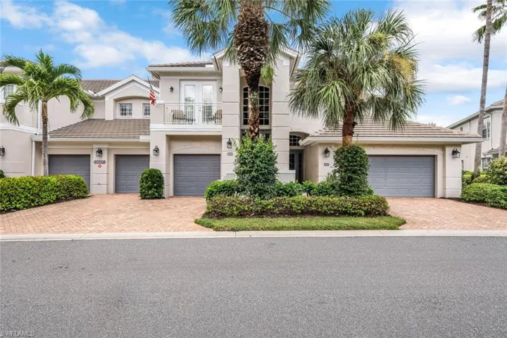 Attractive exterior with mature palms.
