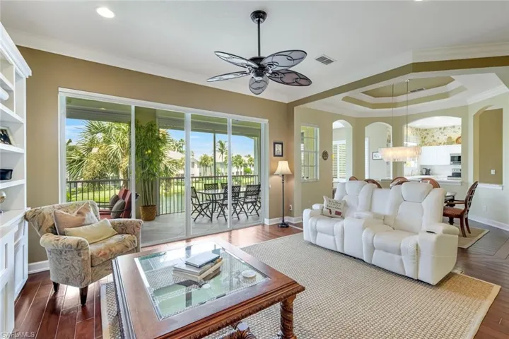 Elegant space with tray ceiling and access to lanai.