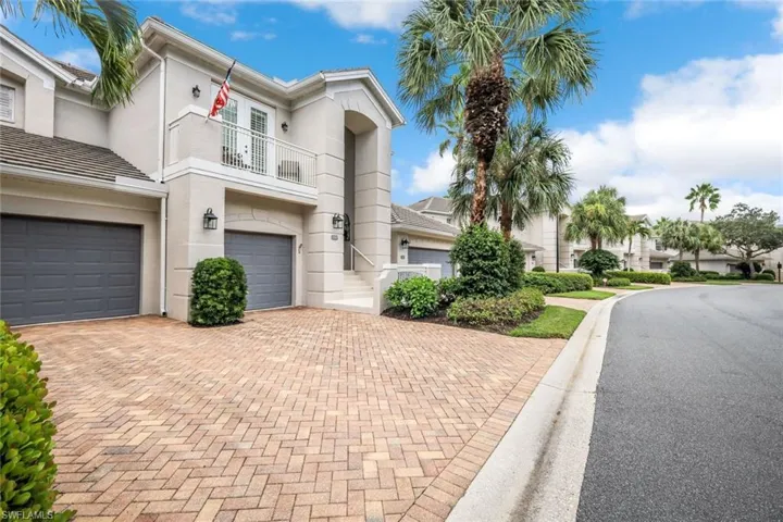 Spacious drive with paver detail.