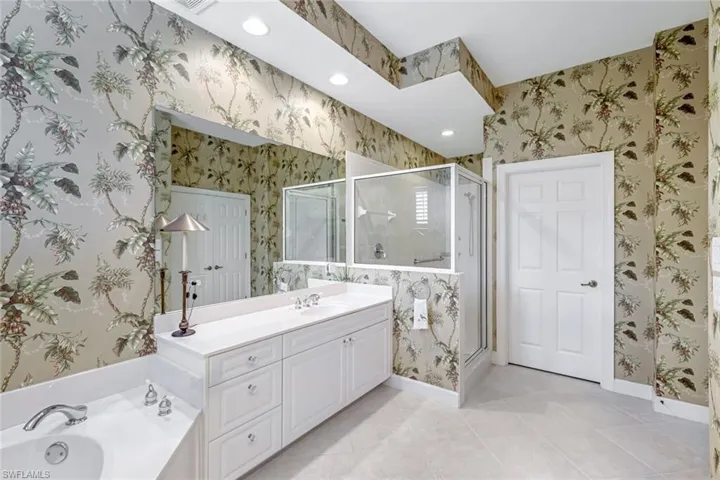 Spacious Primary bath with soaking tub and walk-in shower.