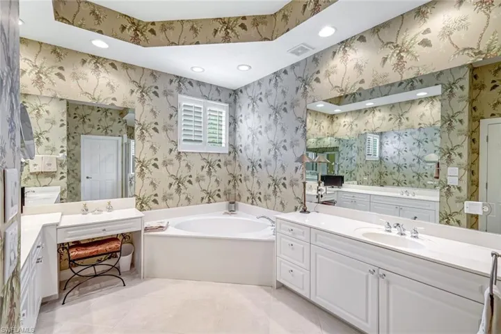 Dual vanities with bright, airy finishes.